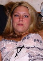 Девушка сидит на мотоцикле в красном корсете 2 фото Девушка сидит на мотоцикле в красном корсете 2 фото