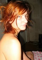 Рыжеволосая бестия занимается гимнастикой в комнате 29 фото Рыжеволосая бестия занимается гимнастикой в комнате 29 фото